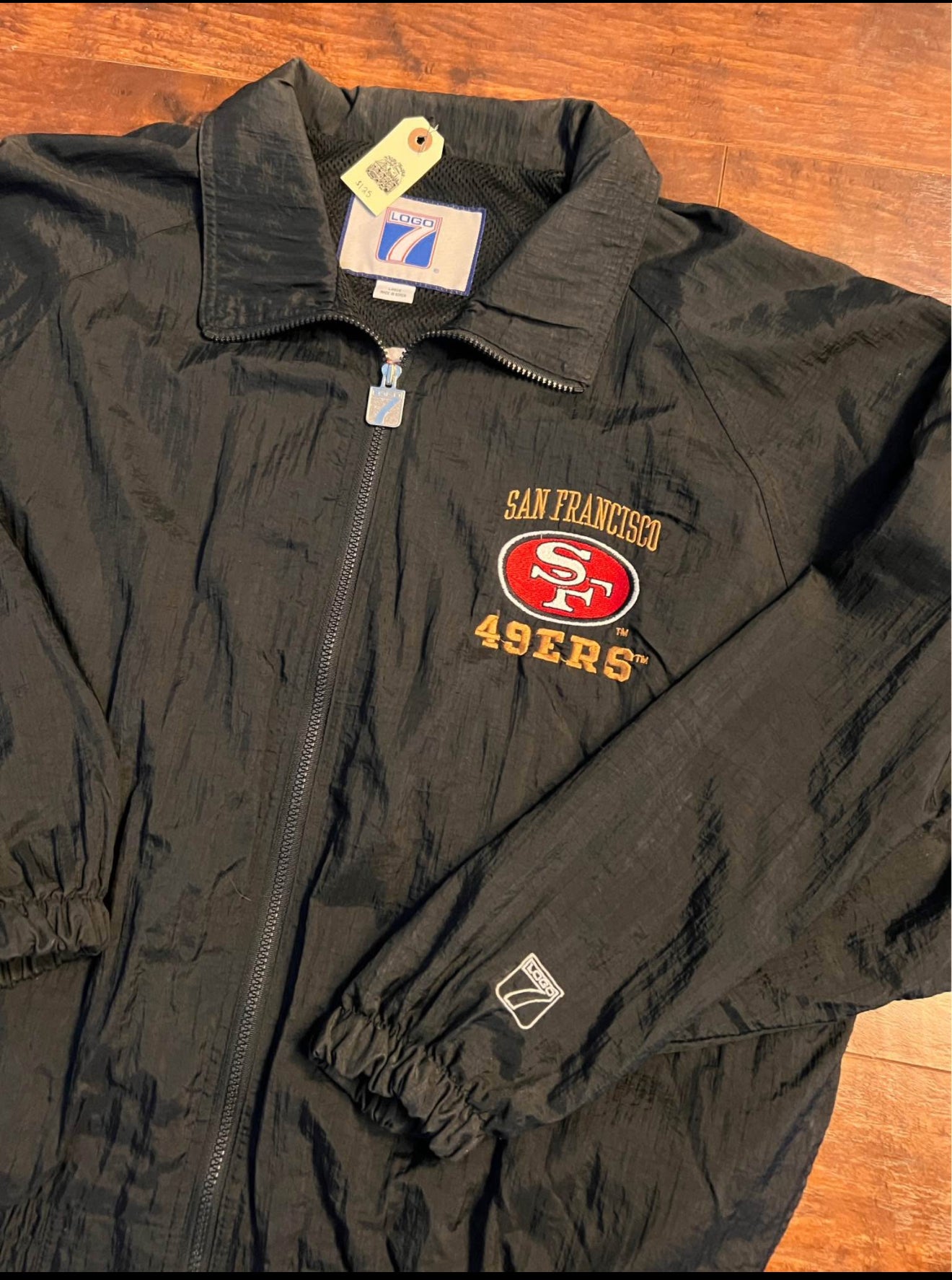 Vintage 90โs Logo 7 - 49ers 5-time Superbowl windbreaker.