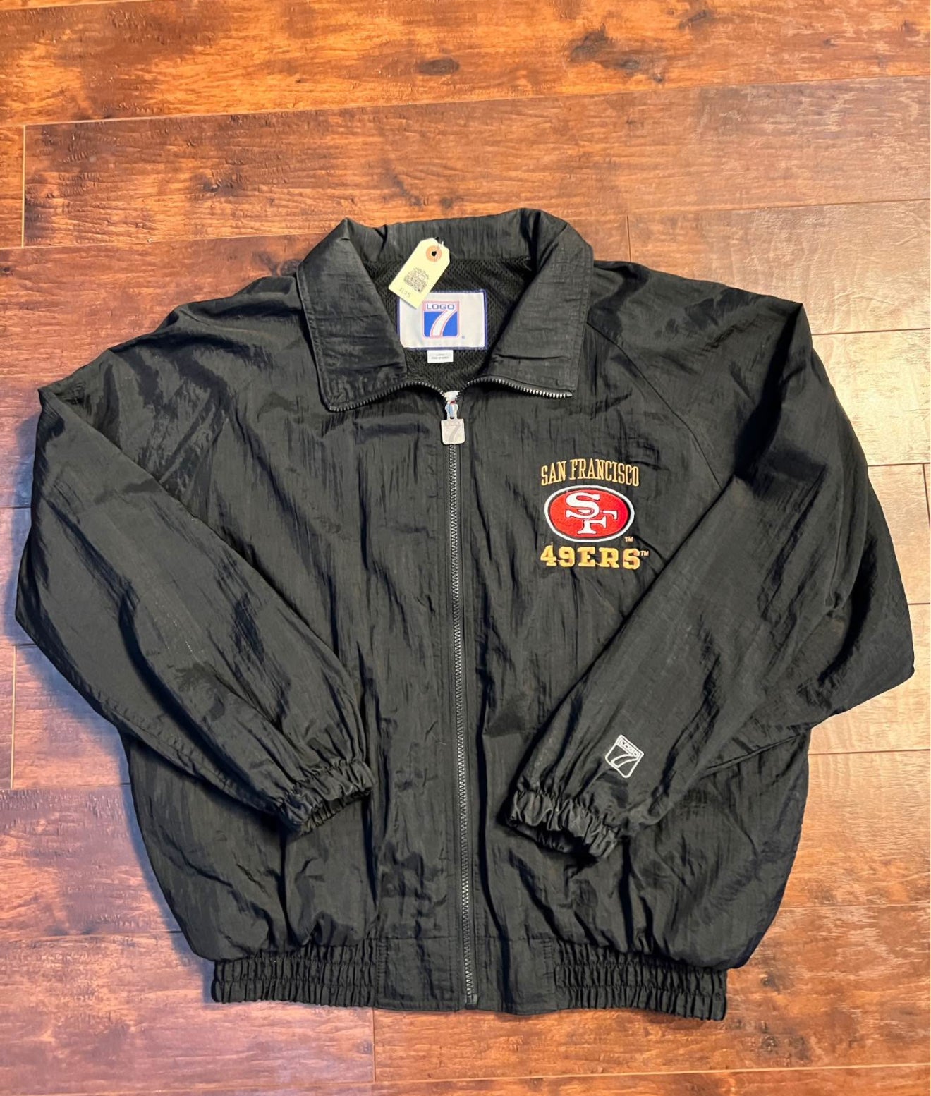 Vintage 90โs Logo 7 - 49ers 5-time Superbowl windbreaker.